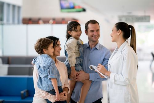 Doctor talking to a Family at a Hospital