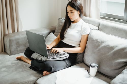 A businesswoman working on a laptop
